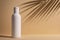 White blank packaging cosmetic bottle with shadow of palm leaves