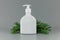 white blank perfume dispenser bottle with pine tree branch