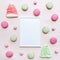 White blank photo frame mockup with various sweets, macaroon, meringues and candies.