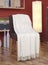 White blanket draped over a chair