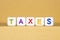 White blocks with colorful Taxes text