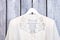White blouse on hanger, close up.