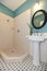 White and blue bathroom with washbasin stand, open shower and to