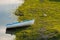 A white blue boat in the water.Boat in lake in nature.Nature