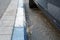 White and blue coloring of the curb on the road to indicate a paid parking in Israel