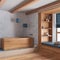 White and blue farmhouse bathroom with wooden bathtub. Window with bench and pillows, plaster concrete walls. Japandi interior