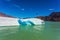 The white-blue ice floe drifts from coastal glacier