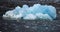 White and blue ice, small icebergs floating in Svalbard