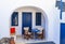 White-blue national greek architecture on Santorini island, Greece. hotel entrance with blue windows in Fira