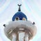 White and blue painted tip of a minaret with loudspeakers and a