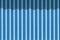 White and blue striped aluminum steel wall with shadow of canvas awning on surface