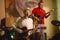 White blues man performs in French Quarter of New Orleans, Louisiana at night on stage playing guitar