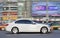 White BMW 5 series in busy city center, Beijing, China