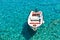White boat at crystal clear blue water of Marmara beach, near Aradena gorge, island of Crete