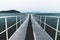 White boat jetty reaching into the sea, Naoshima, Japan