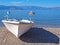 White boat on Nikolaiika Beach and the Corinthian Gulf, Greece