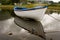 White boat during rainy day