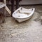 White Boat Tied To Dilapidated Jetty