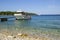 White boat for transportation of tourists, travelers and vacationers passengers, moored to the pier. Adriatic Sea, Croatia