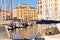 White boats, blue sky and colorful buildings at Piran harbor, Istria