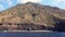 White boats moored in Mediterranean sea at Lipari Island. Blue sky with white clouds. Summer sunny day. Sicily, Italy