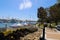 White boats and yachts at the docks in the harbor with deep blue ocean water and blue sky at Burton Chace Park