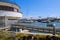 White boats and yachts at the docks in the harbor with deep blue ocean water and blue sky at Burton Chace Park