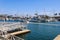 White boats and yachts at the docks in the harbor with deep blue ocean water and blue sky at Burton Chace Park