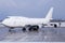 White Boeing 747-400 Jumbo Jet freighter with red tail on the ground in Graz