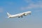 White Boeing 777 9V-SWI of Singapore Airlines takes off. Jet plane on the background of the blue sky. International