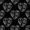 White boho ornamental hearts on black background seamless pattern