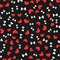 White bones for dogs and red hearts randomly scattered on black background. Seamless pattern.