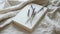 a white book mockup accompanied by a delicate bouquet of lavender, resting on a serene beige table.