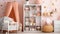 White bookcase with plush toys and decorations in a cute, cozy, white and peach pink scandinavian nursery interior