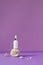 White bottle cosmetic serum amethyst color background