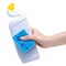 White bottle toilet cleaner with cleaning sponge in hand