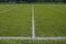 White boundary lines of football playing field