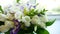 White bouquet roses stand on window indoors sill near the window