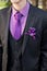 White boutonniere groom closeup.