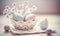 a white bowl filled with eggs on top of a white table cloth next to a vase with flowers in it and a lace doily doily doily on the