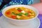 White bowl of spicy thai Tom yum kung.