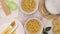 White bowls with pasta moving on table with kitchen utensils - Stop motion