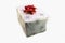 White box, christmas present with stars decorate wrap and red shiny ribbon in white isolated container. Decoration paper for xmas