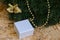 White box with a gift, Christmas wreath, Christmas tree decorations.