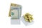 A white box with golden gift ribbon with with new United stated dollar