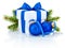 White box tied blue ribbon bow, pine tree branch and christmas balls