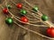 WHITE BRANCHES WITH RED AND GREEN SPARKLY BALLS, DECORATIONS