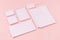 White branding stationery, mock up scene on light soft pastel pink background, blank objects for placing your design.