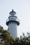 White Brick Lighthouse Rising out of Trees