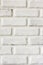 White brick lined wall texture vertical background